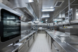 Modern industrial kitchen with stainless steel appliances, modular countertops, and hygienic layout—engineered for marine catering, offshore galley systems, and professional food preparation by ALMACO.
