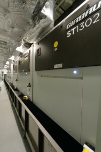 GIRBAU ST1302 industrial laundry machines in an insulated facility – part of ALMACO’s turnkey laundry solutions for cruise ships, offshore platforms, and marine accommodation.