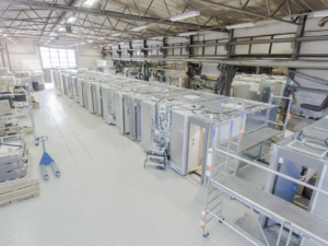 Industrial warehouse with modular electrical cabinets and technical equipment – ALMACO marine engineering and prefabricated solutions