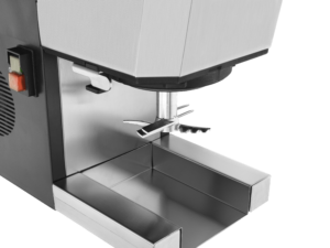 Commercial espresso machine with metallic finish – close-up of portafilter holder, drip tray, and on/off switch for professional coffee brewing.