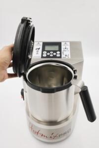 HotmixPRO multifunctional kitchen appliance with open stainless steel mixing container and digital control panel – professional-grade food processor for precision cooking.