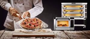 Chef holding pizza peel with pepperoni and olive pizza beside commercial deck oven and rotisserie – ALMACO marine galley and foodservice equipment