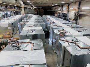 Industrial warehouse with rows of modular technical units under assembly – ALMACO prefabricated systems for marine and offshore engineering
